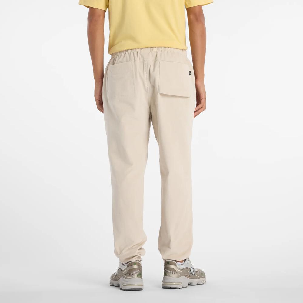 Pánské kalhoty New Balance MP53521TWF - béžové