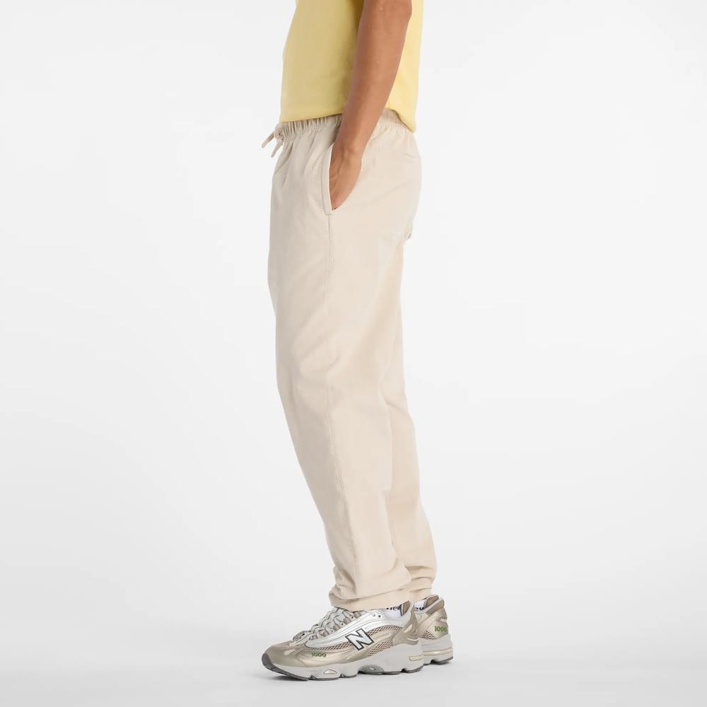 Pánské kalhoty New Balance MP53521TWF - béžové