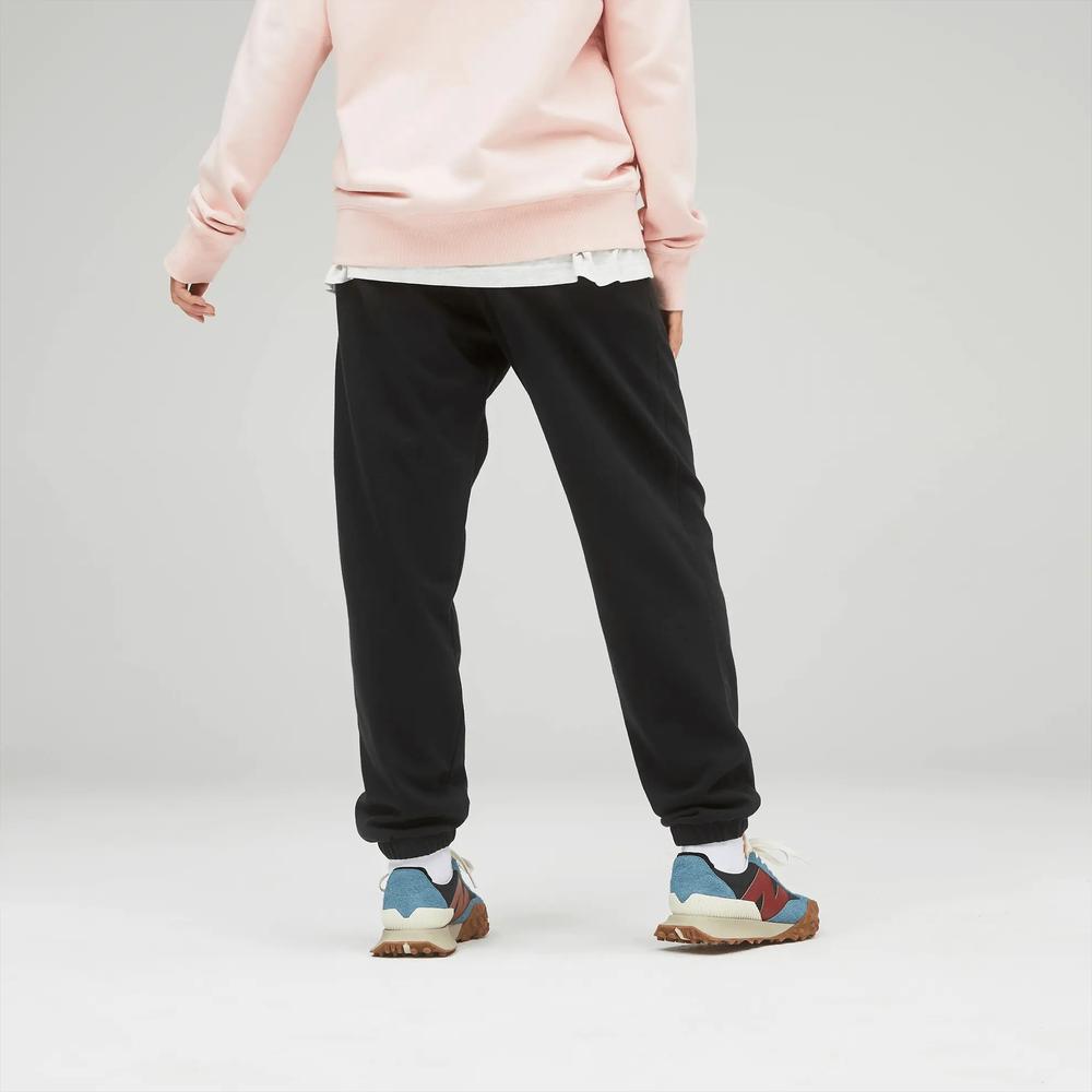 Sportovní tepláky New Balance UP21500BK - černé