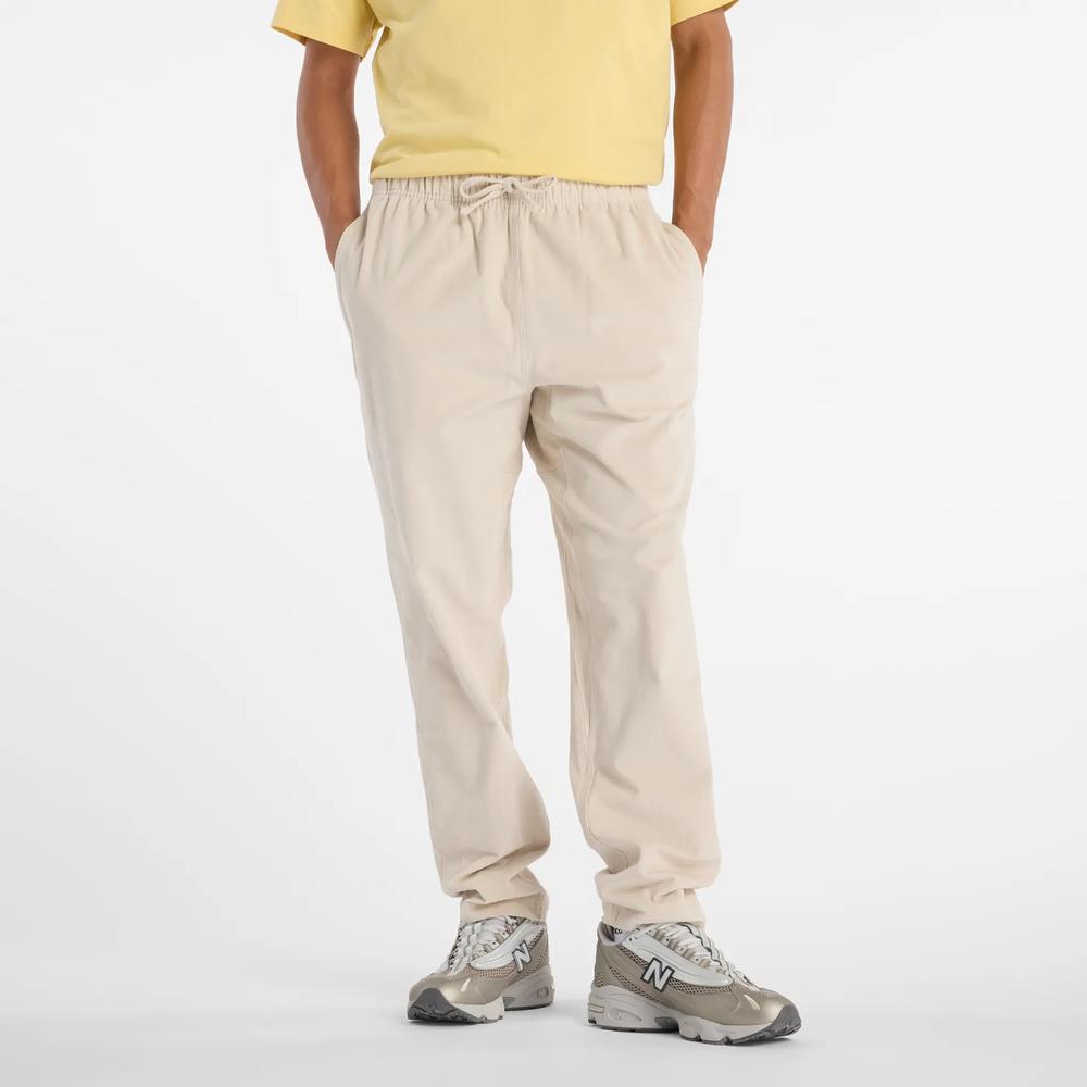 Pánské kalhoty New Balance MP53521TWF - béžové