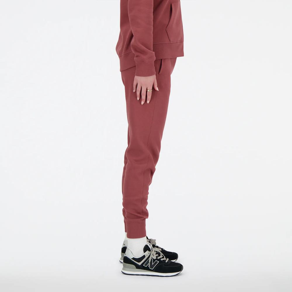 Sportovní tepláky New Balance WP03805WAD - růžové