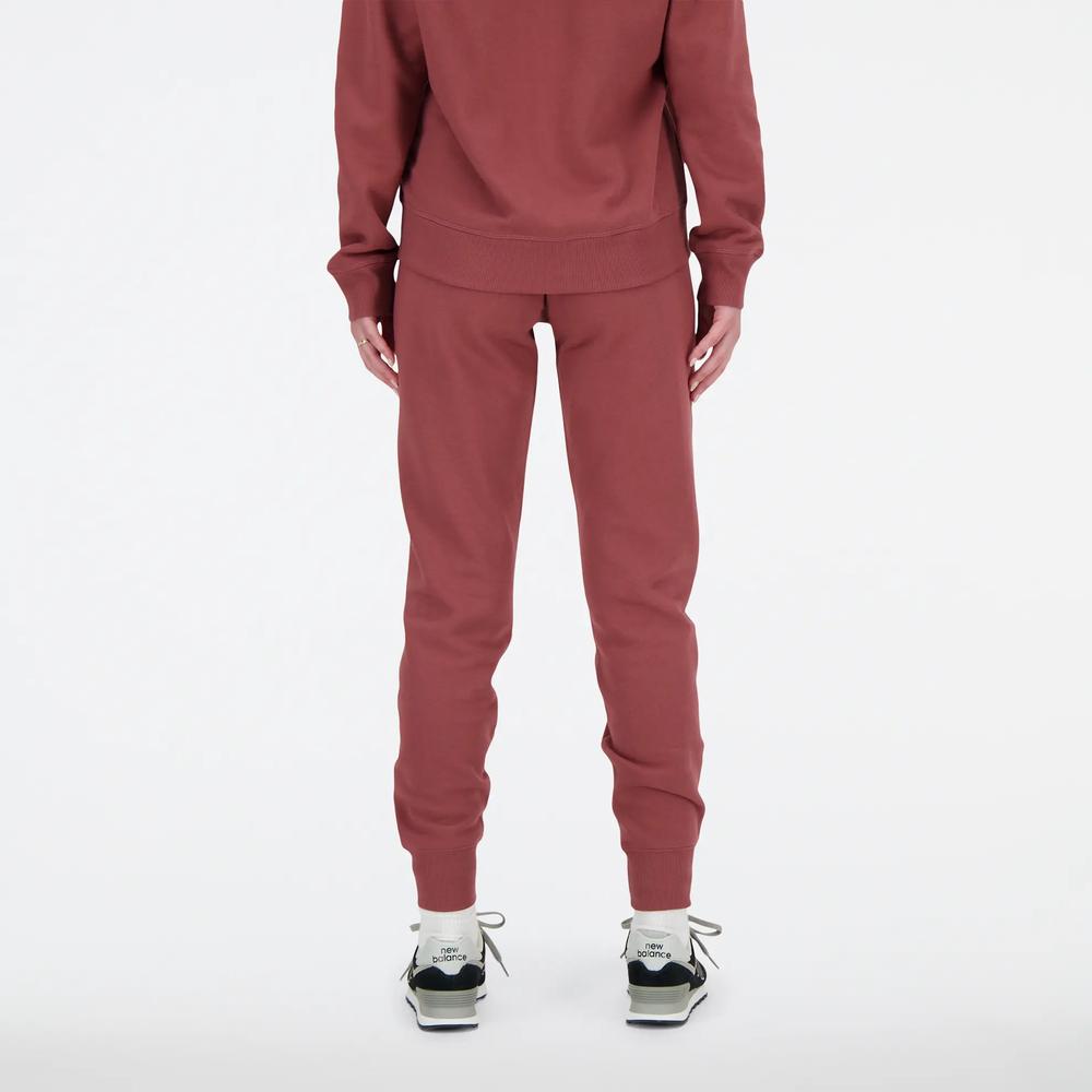 Sportovní tepláky New Balance WP03805WAD - růžové