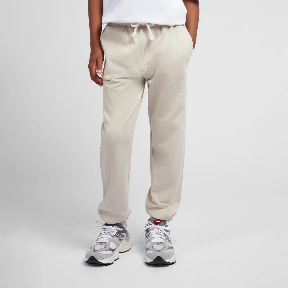 Dětské kalhoty New Balance LAKB0060TWF - béžové