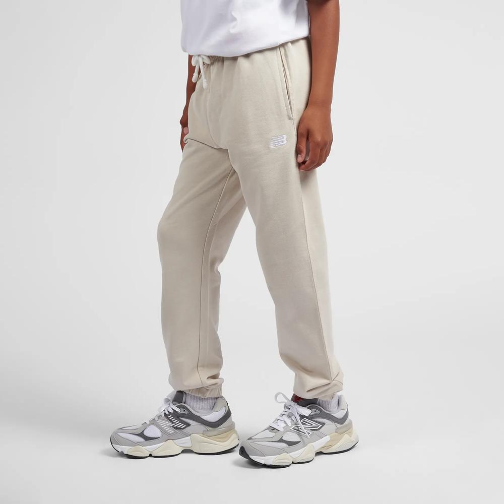 Dětské kalhoty New Balance LAKB0060TWF - béžové