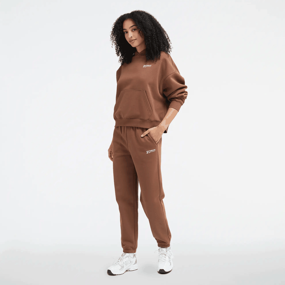 Kalhoty New Balance WP33513PNC - hnědé