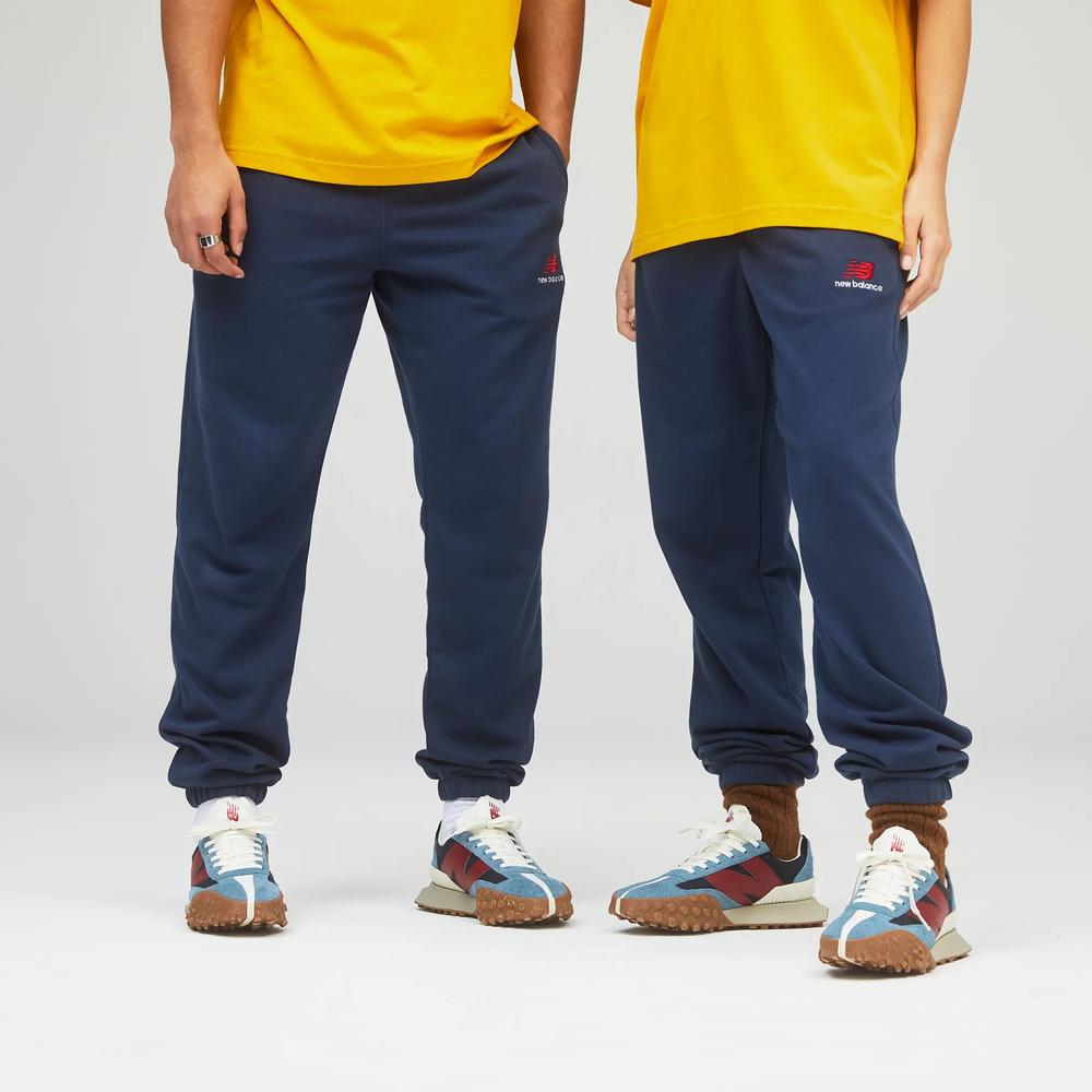 Unisex kalhoty New Balance UP21500NGO – tmavomodrá