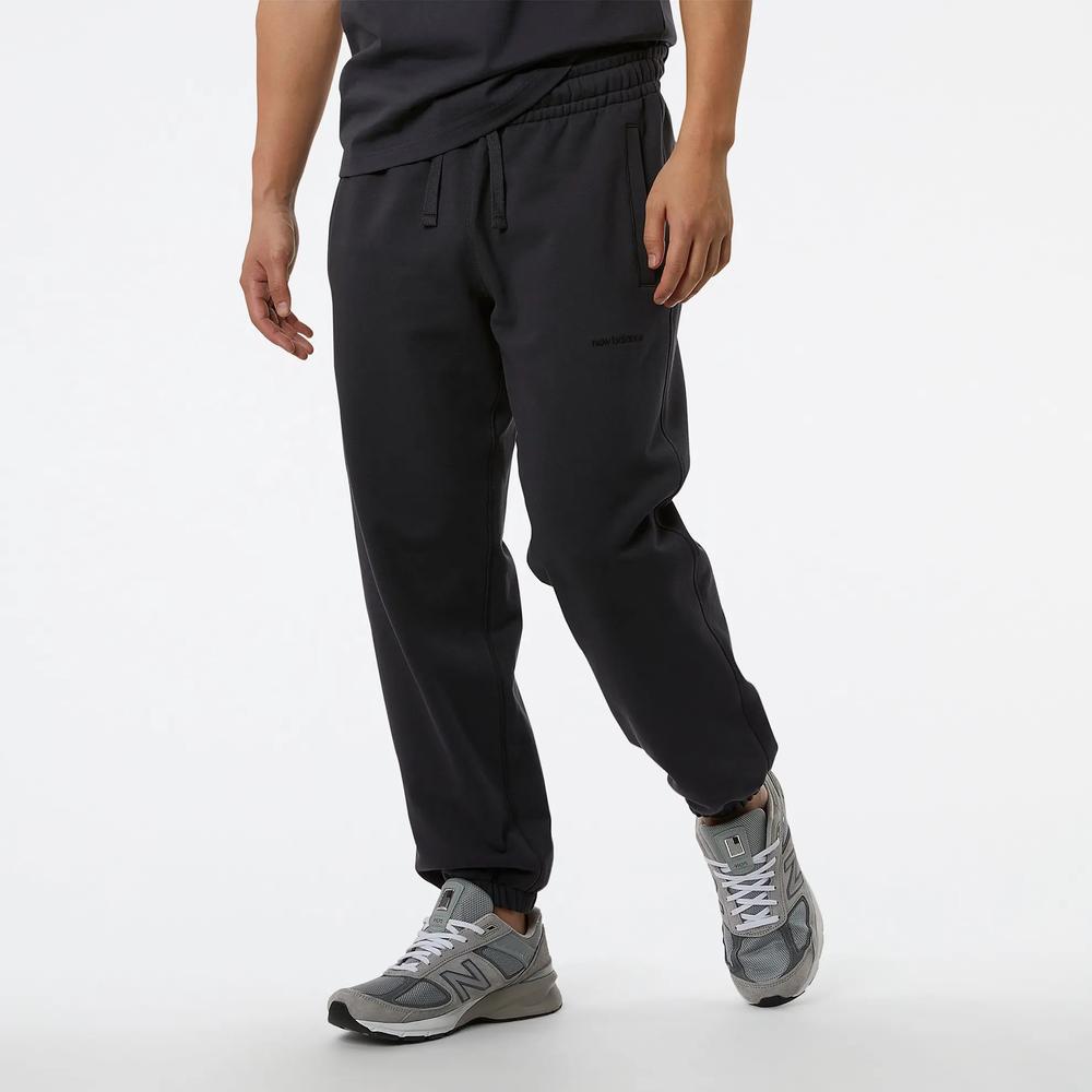 Sportovní tepláky New Balance MP23551PHM - černé