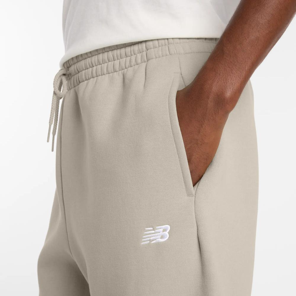 Pánské kalhoty New Balance MP41503TWF - béžové