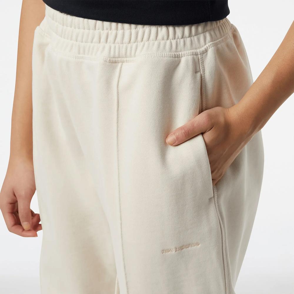 Kalhoty New Balance WP23553GIE – béžové