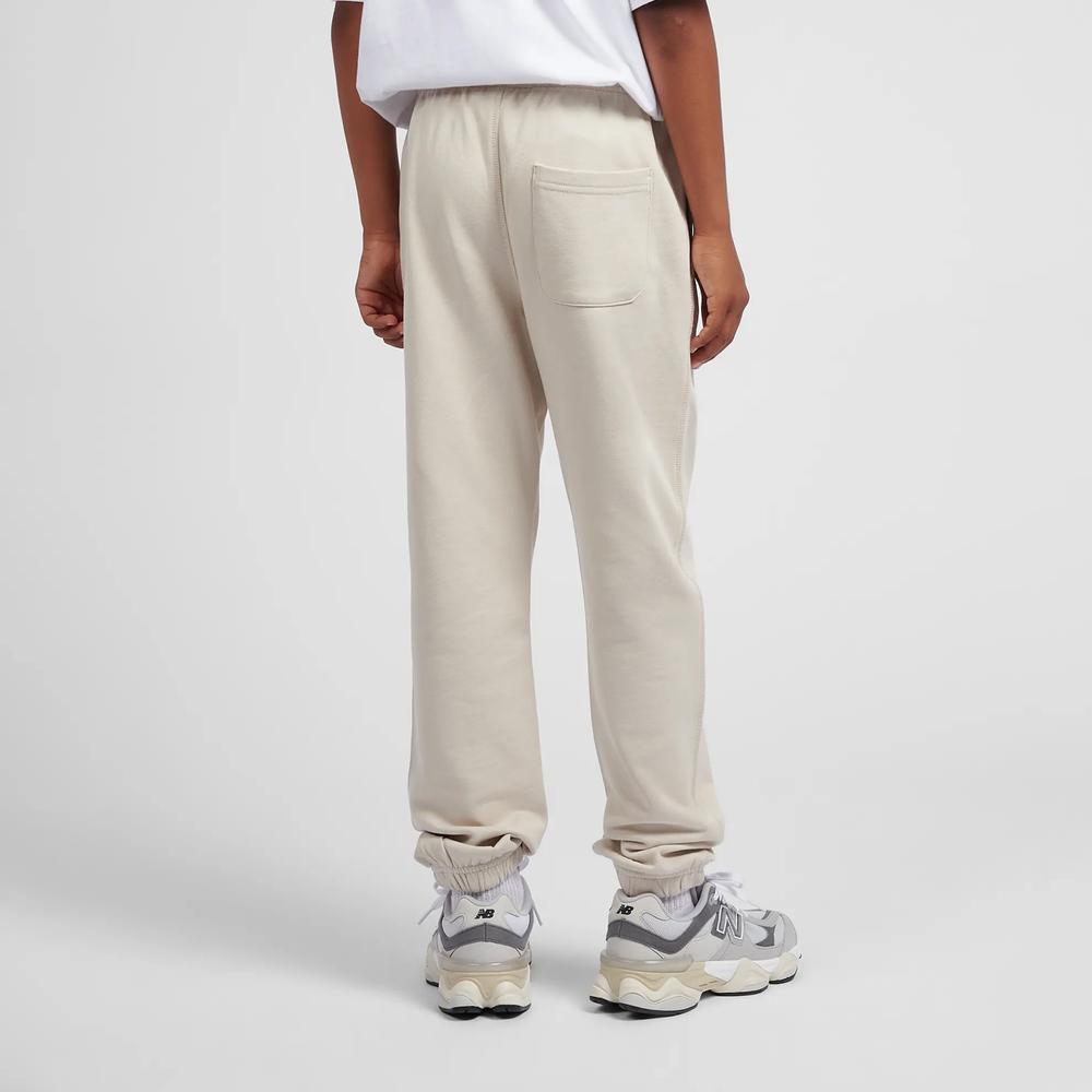 Dětské kalhoty New Balance LAKB0060TWF - béžové