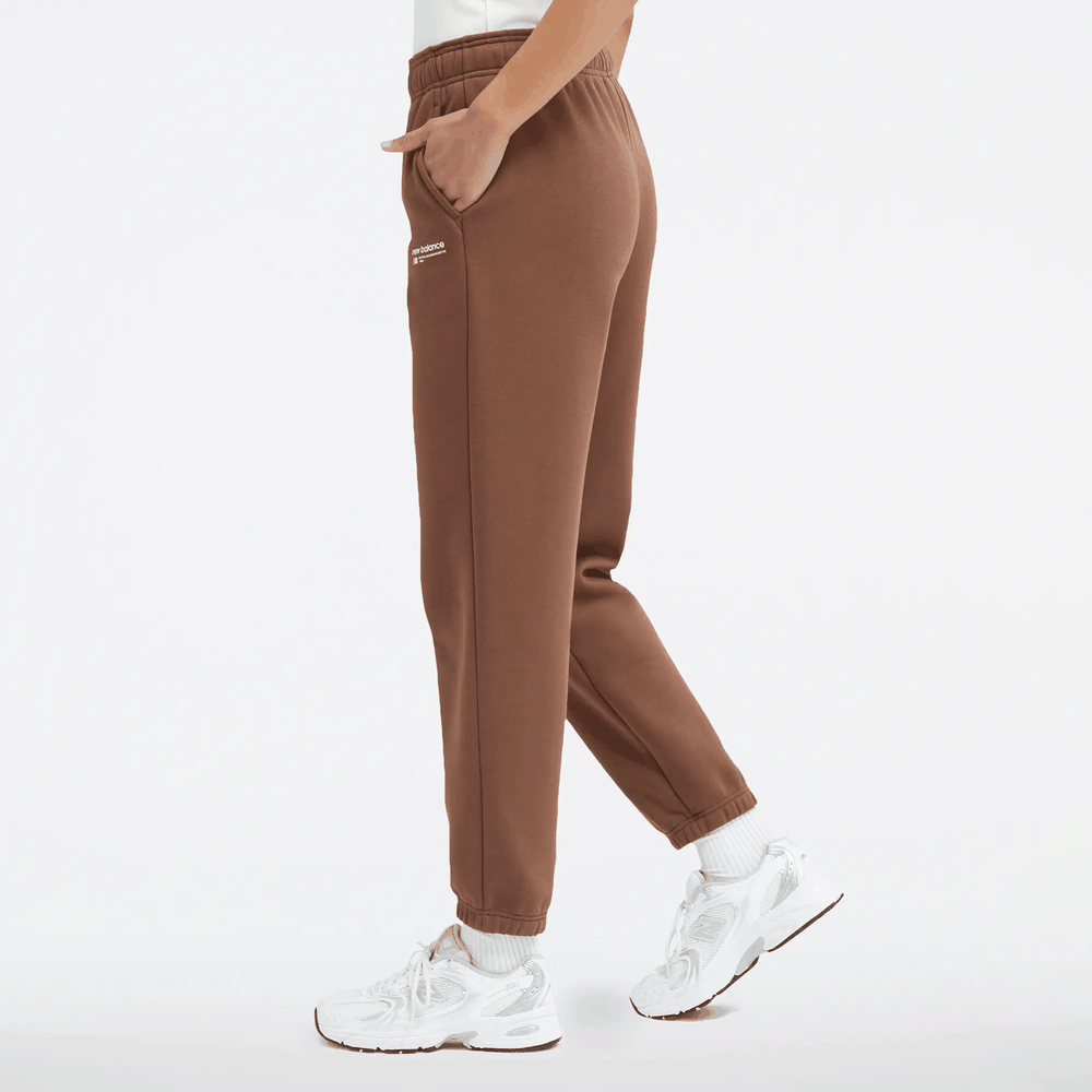 Kalhoty New Balance WP33513PNC - hnědé