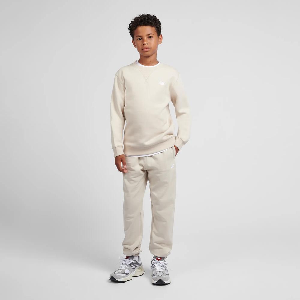 Dětské kalhoty New Balance LAKB0060TWF - béžové