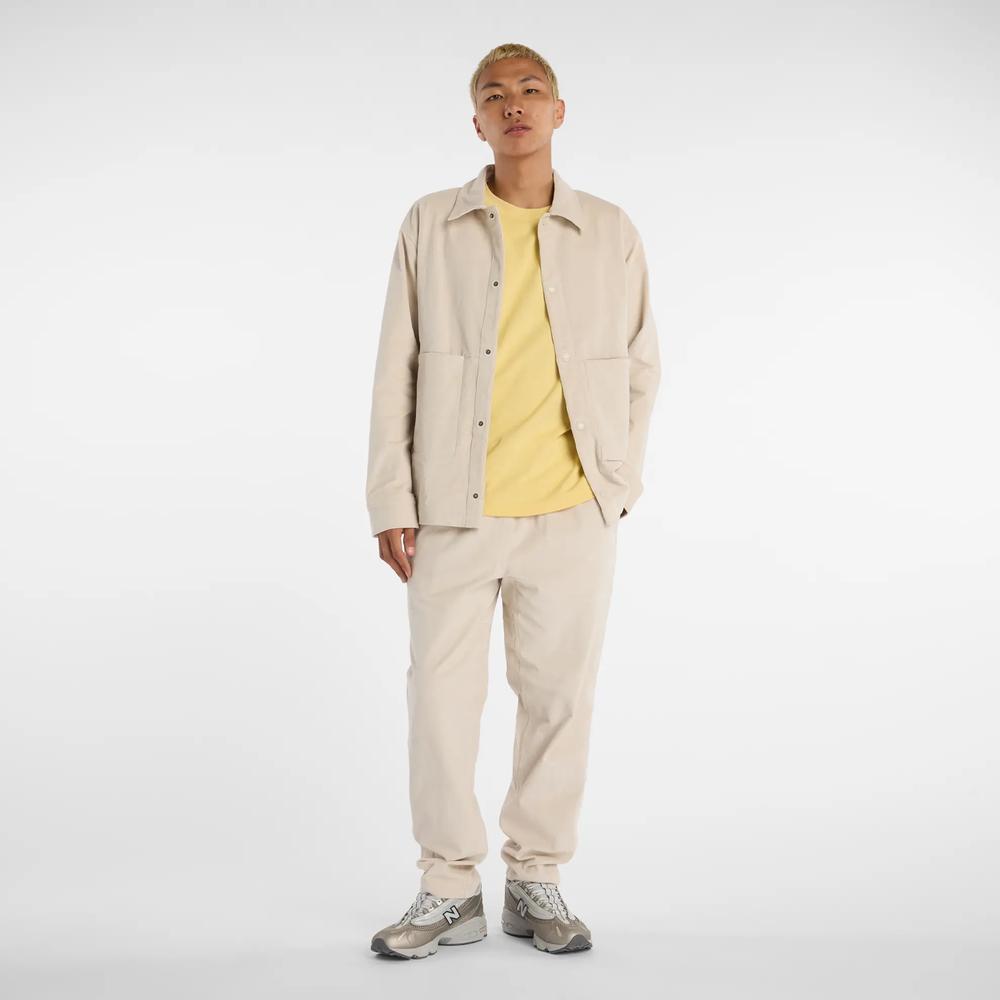 Pánské kalhoty New Balance MP53521TWF - béžové