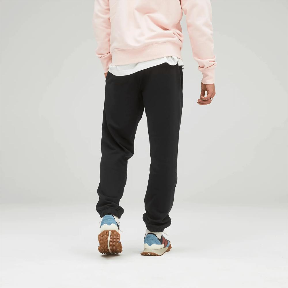 Sportovní tepláky New Balance UP21500BK - černé